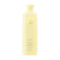 Oribe Hair Alchemy fortifying treatment serum bottle, pale yellow.