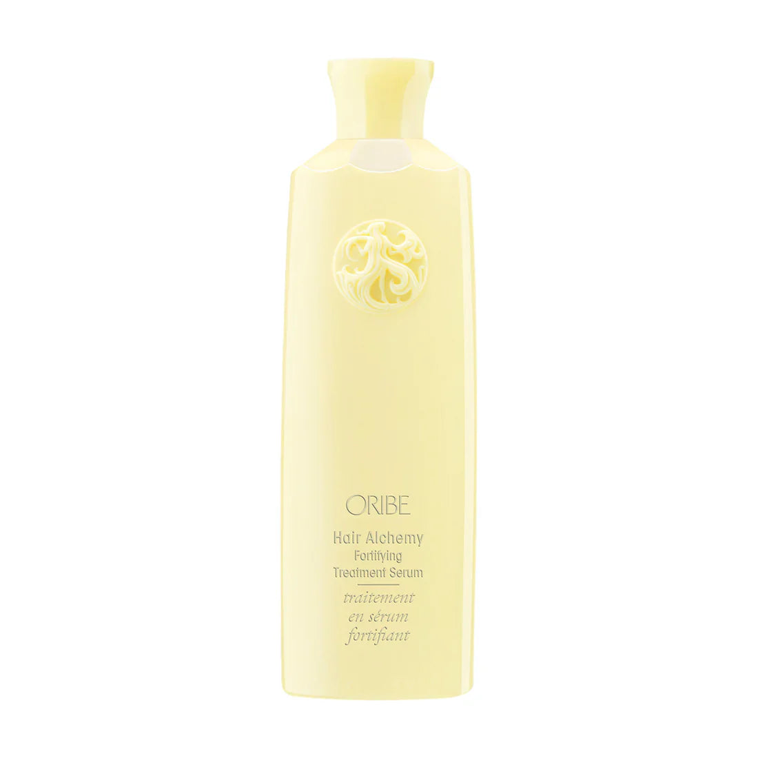 Oribe Hair Alchemy fortifying treatment serum bottle, pale yellow.
