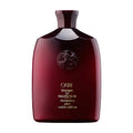Oribe shampoo bottle, dark burgundy with cap and front label