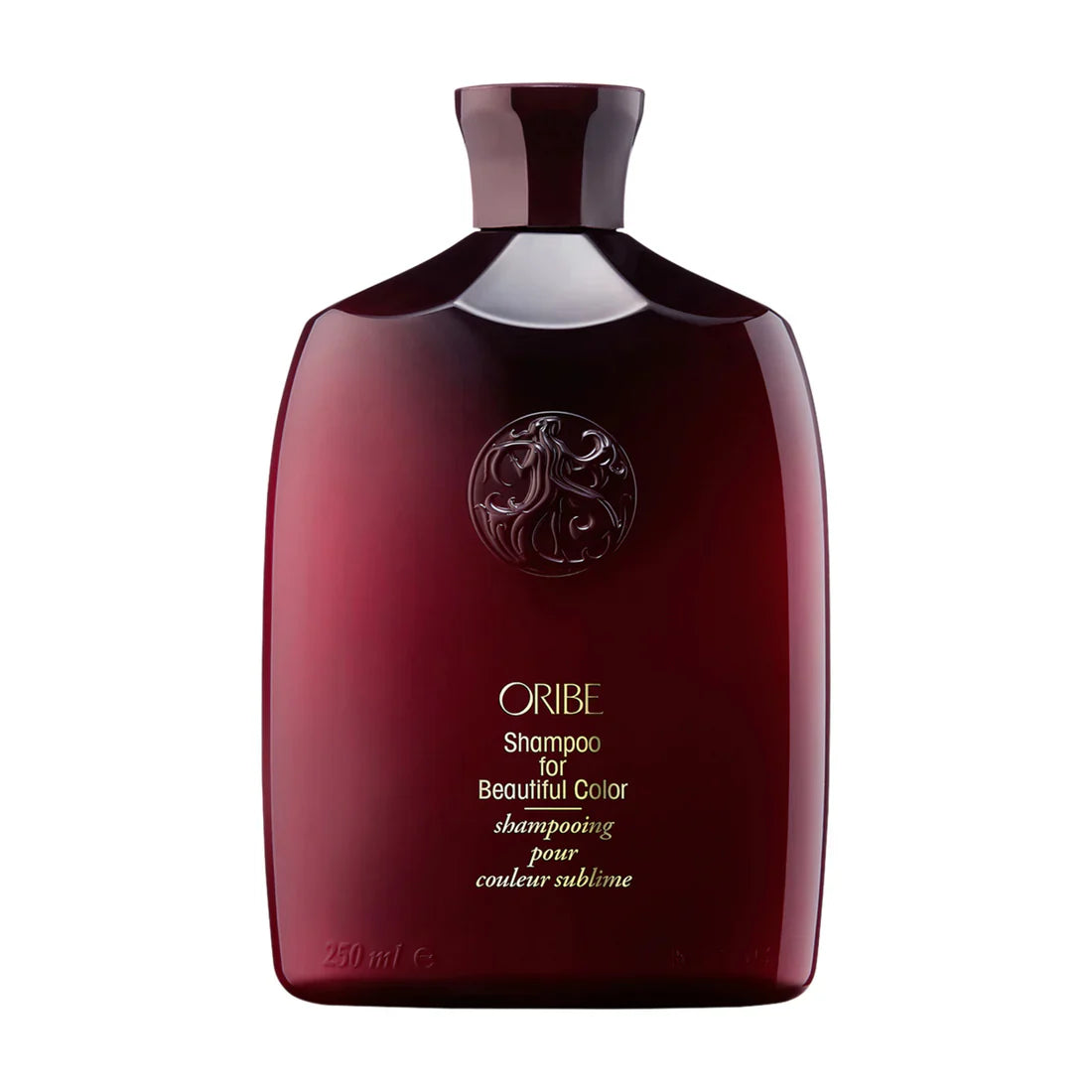 Oribe shampoo bottle, dark burgundy with cap and front label