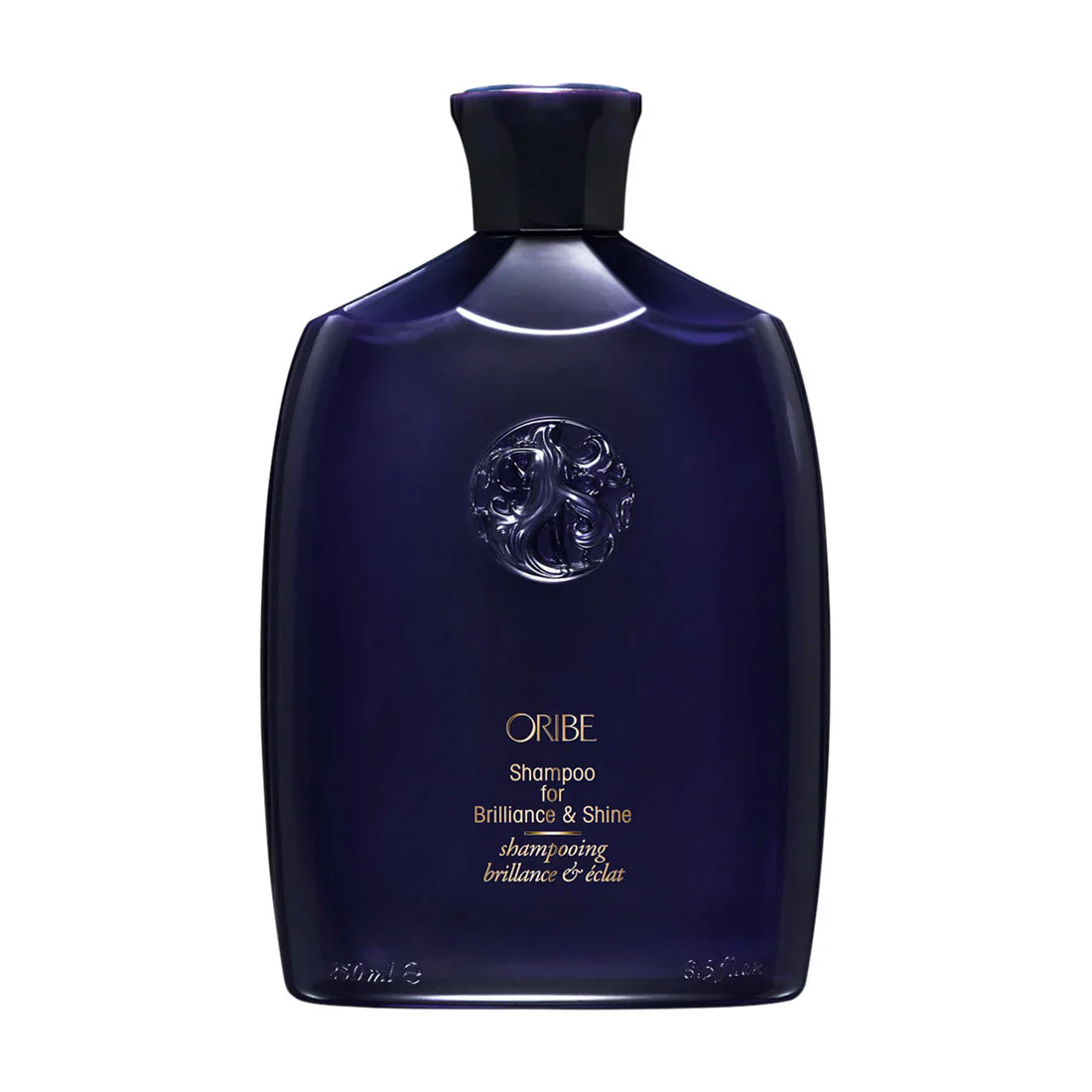 Oribe shampoo bottle, dark navy blue plastic with flip-top cap and embossed logo