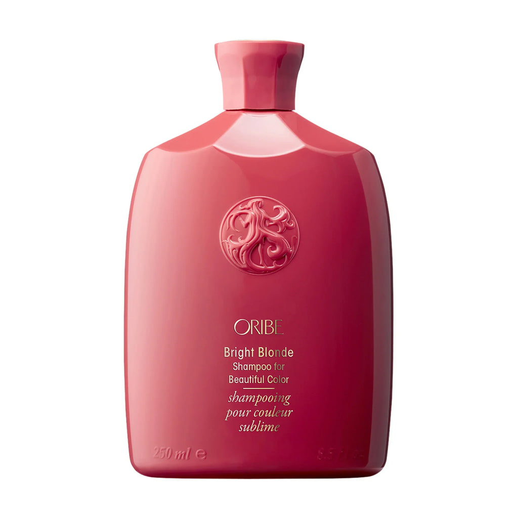Oribe Bright Blonde shampoo bottle, red-pink with logo on front