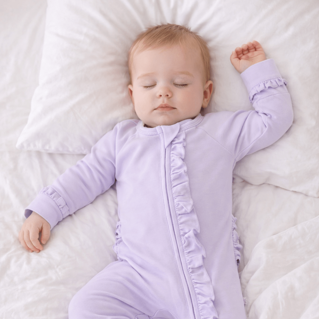 Lavender ruffle footie with front zipper and long sleeves