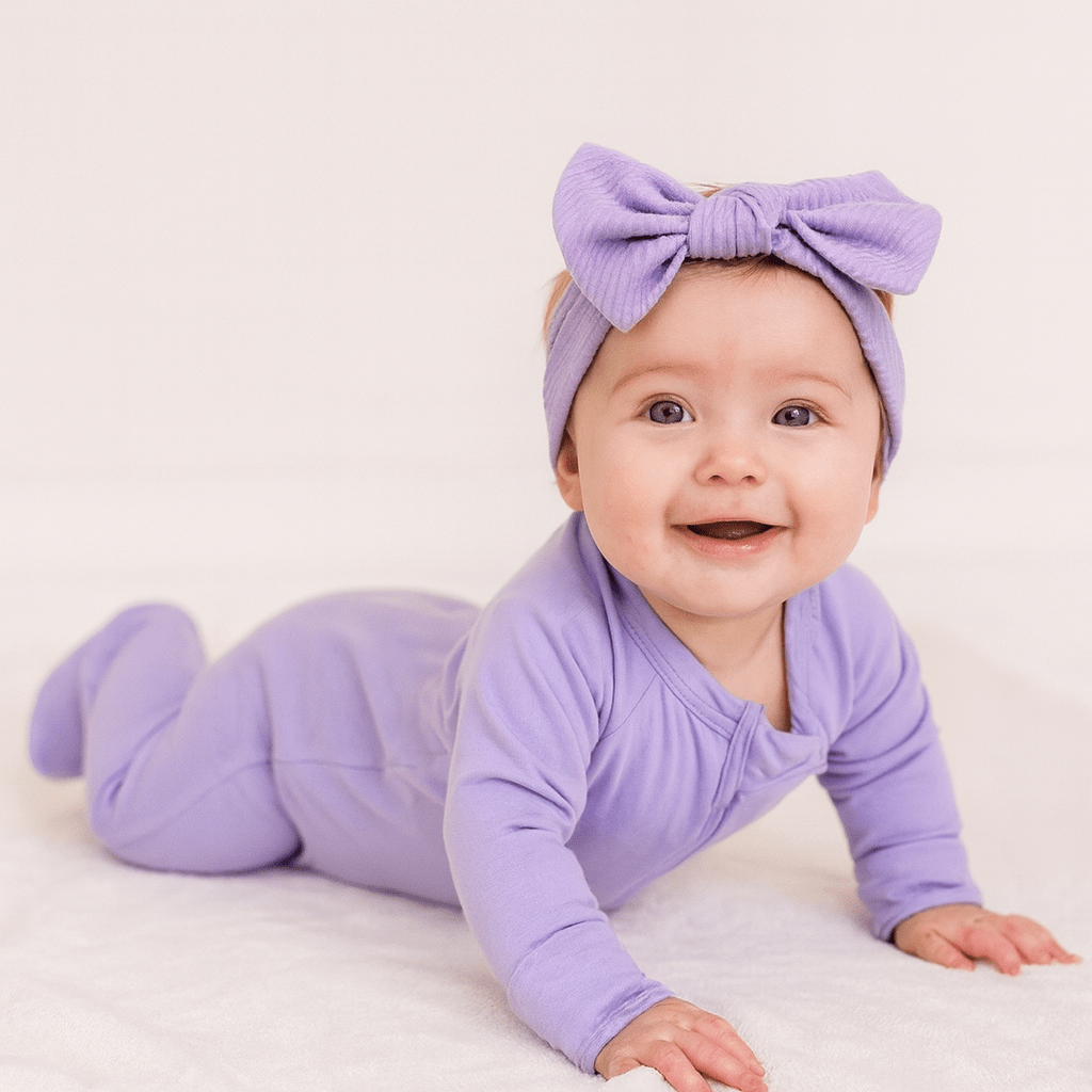 Lavender zip-front baby footie with long sleeves and matching knotted hat