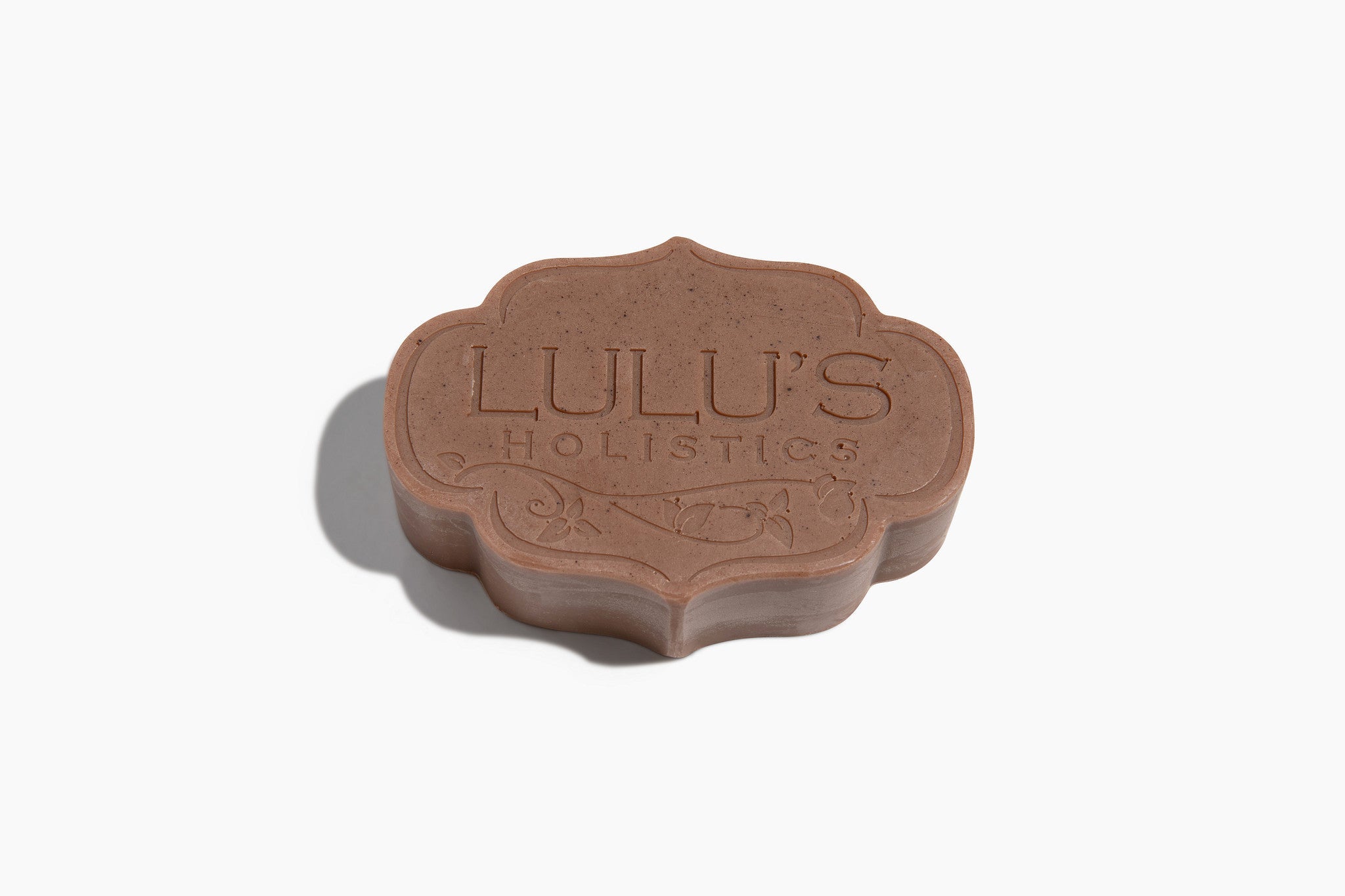 Brown flower-shaped bar soap with LULU'S HOLISTIC embossed text