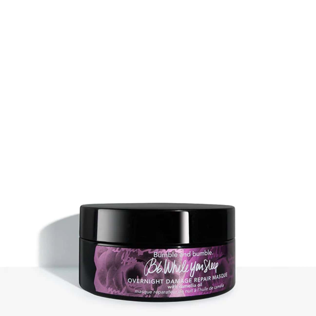 Bumble and bumble overnight damage repair masque jar with black lid, purple label