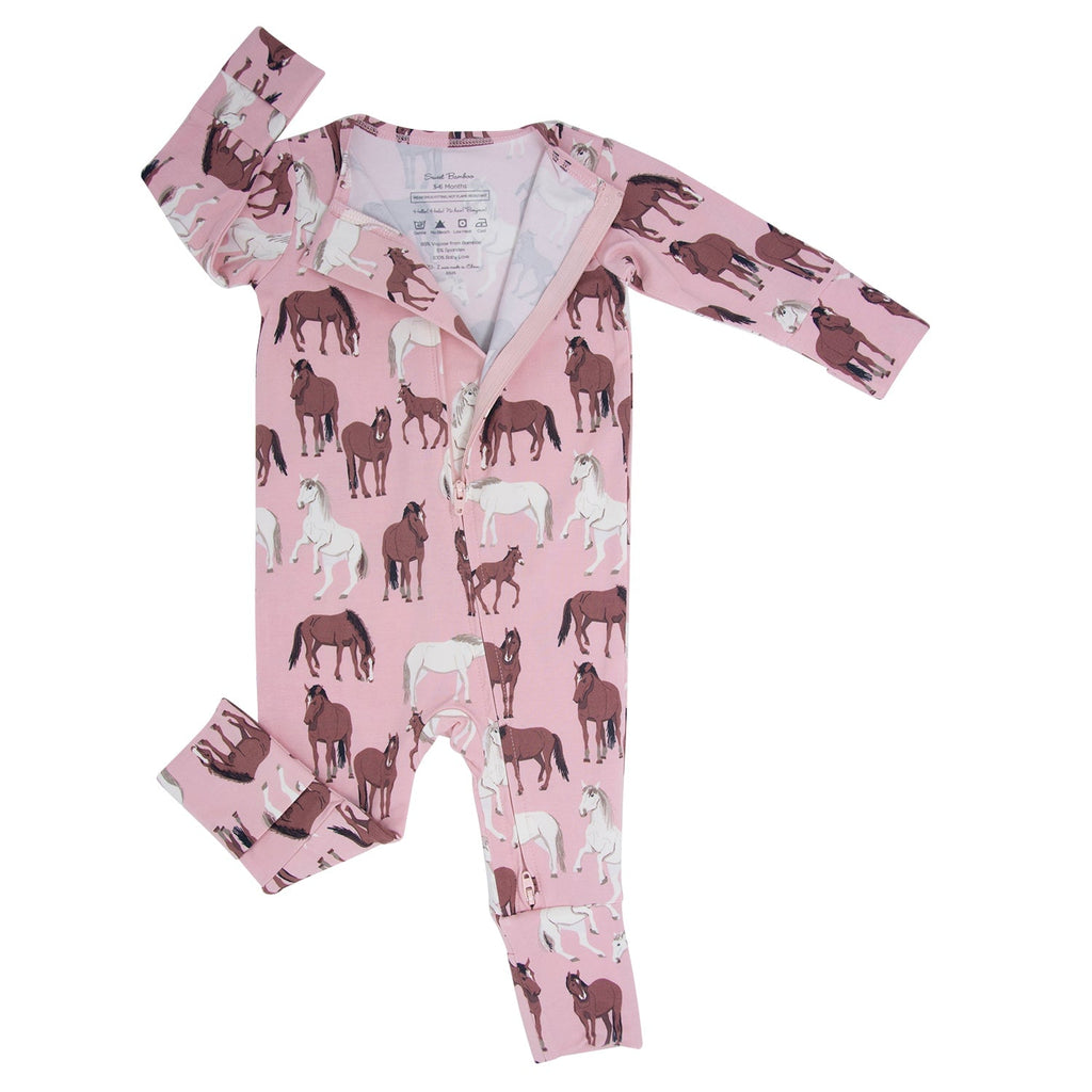 Girls' pale pink horse-print convertible romper with long sleeves and front zipper