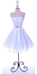 White knee-length strapless A-line dress with ruched bodice and flared tulle skirt