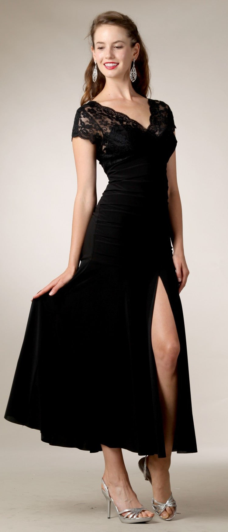 Black tea-length dress with lace sleeves, gathered waist, and side slit