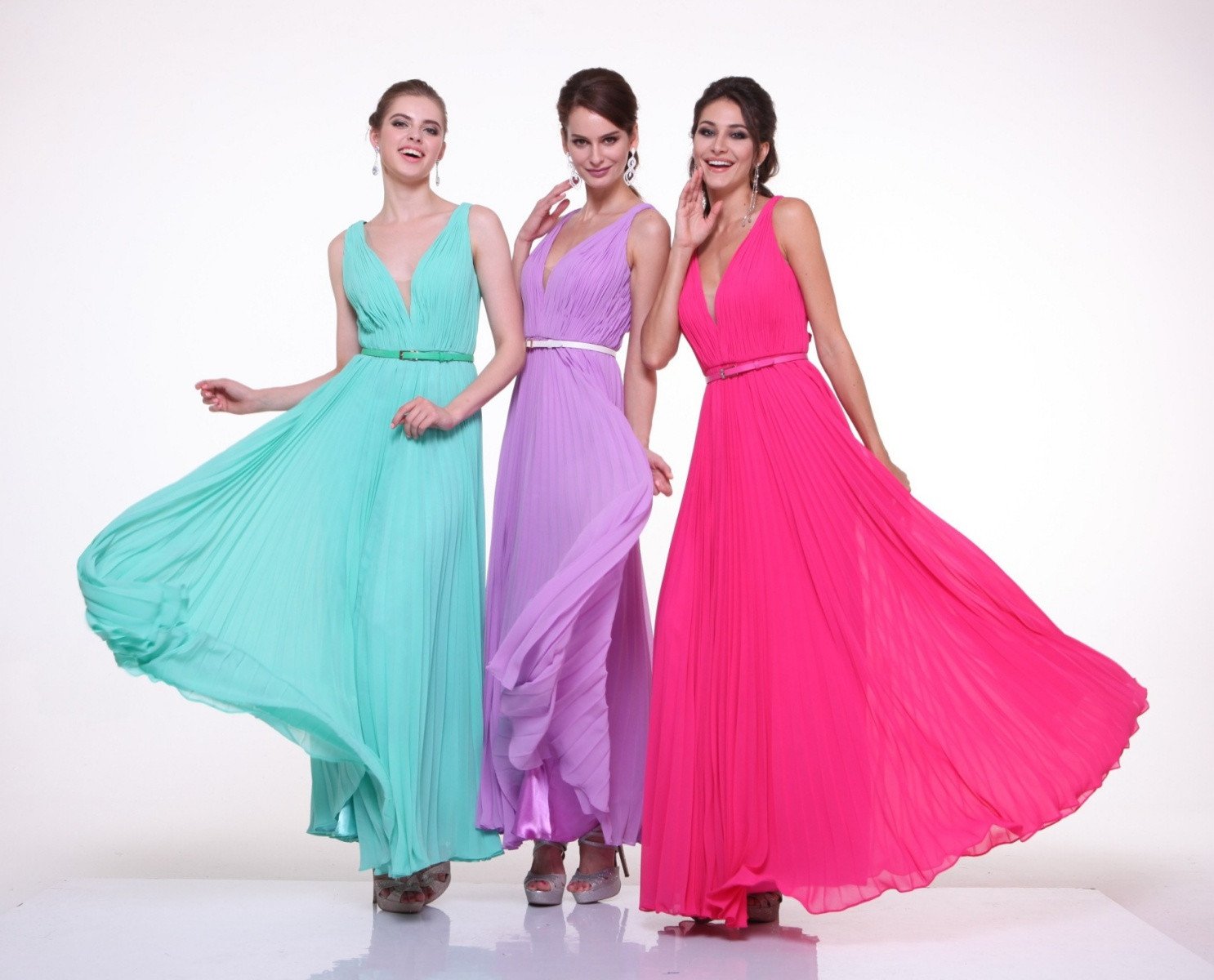 Three long chiffon pleated sleeveless dresses: mint, lavender, and hot pink with waist belts