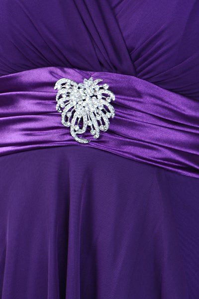 Purple fabric dress with ornate silver rhinestone waist brooch