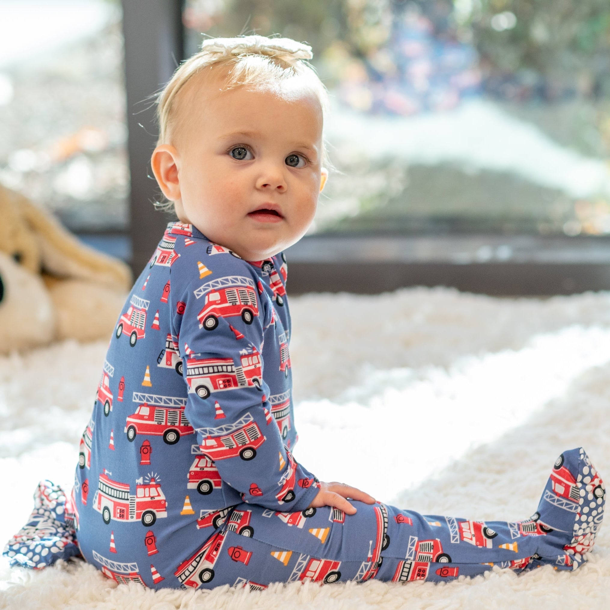 Blue fire truck zipper footie with red emergency vehicle print, long sleeves