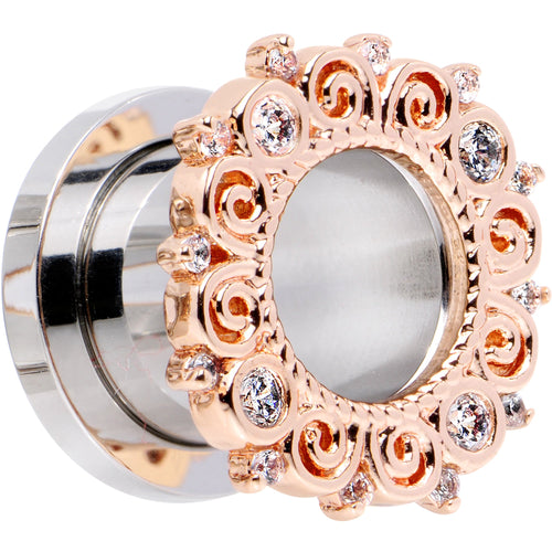 Rose gold-tone tunnel plug with clear gem floral border, angled view